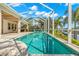 Inviting screened pool and spa with open patio and water views at 709 Manns Harbor Dr, Apollo Beach, FL 33572