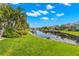 Scenic waterfront property with lush landscaping and private dock at 709 Manns Harbor Dr, Apollo Beach, FL 33572
