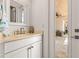 Light and bright powder room with a view of the patio at 709 Manns Harbor Dr, Apollo Beach, FL 33572