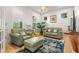 Bright sitting room with two armchairs and a sofa at 709 Manns Harbor Dr, Apollo Beach, FL 33572