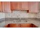Kitchen boasts granite countertops and a double sink at 880 Mandalay Ave # C713, Clearwater Beach, FL 33767
