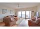 Living room with ocean view and hardwood floors at 880 Mandalay Ave # C713, Clearwater Beach, FL 33767