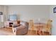 Bright living room with comfy seating and a small dining area at 880 Mandalay Ave # C713, Clearwater Beach, FL 33767