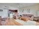 Living room with hardwood floors and kitchen view at 880 Mandalay Ave # C713, Clearwater Beach, FL 33767