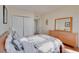Spacious bedroom with a large bed, dresser, and closet at 880 Mandalay Ave # C713, Clearwater Beach, FL 33767
