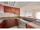 Well-equipped kitchen with granite counters and stainless steel appliances at 880 Mandalay Ave # C713, Clearwater Beach, FL 33767