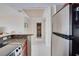 View of kitchen, hallway, and bathroom entrance at 880 Mandalay Ave # C713, Clearwater Beach, FL 33767