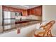 Kitchen features granite countertops and stainless steel appliances at 880 Mandalay Ave # C713, Clearwater Beach, FL 33767