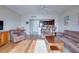 Living room with hardwood floors and kitchen view at 880 Mandalay Ave # C713, Clearwater Beach, FL 33767