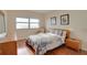 Bedroom with ocean view, wood floors, and comfortable furnishings at 880 Mandalay Ave # C713, Clearwater Beach, FL 33767