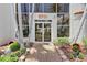 Condo building entrance with landscaped walkway at 5701 Bahia Del Mar Cir # 507, St Petersburg, FL 33715