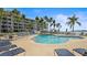 Community pool with lounge chairs and waterfront views at 5701 Bahia Del Mar Cir # 507, St Petersburg, FL 33715