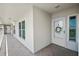 Condo hallway with white door and wreath at 5701 Bahia Del Mar Cir # 507, St Petersburg, FL 33715
