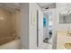 Updated bathroom with tub and shower, double vanity, and access to bedroom at 5701 Bahia Del Mar Cir # 507, St Petersburg, FL 33715
