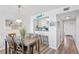 Dining area with kitchen pass-through and wood flooring at 5701 Bahia Del Mar Cir # 507, St Petersburg, FL 33715