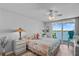 Bedroom with water view, and comfortable bedding at 5701 Bahia Del Mar Cir # 507, St Petersburg, FL 33715