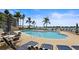 Community pool with lounge chairs and waterfront views at 5701 Bahia Del Mar Cir # 507, St Petersburg, FL 33715