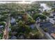 House nestled amongst lush vegetation near a waterway at 55 W Lemon St, Tarpon Springs, FL 34689