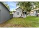 House exterior showing side yard and neighboring house at 55 W Lemon St, Tarpon Springs, FL 34689