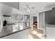 Modern kitchen with white cabinets, granite countertops, and stainless steel appliances at 55 W Lemon St, Tarpon Springs, FL 34689