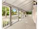 Front porch with white railings and wooden flooring at 55 W Lemon St, Tarpon Springs, FL 34689