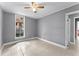 Well-lit bedroom with tile floors and ceiling fan at 55 W Lemon St, Tarpon Springs, FL 34689
