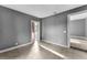 Sunlit spare room featuring tile floors and access to another room at 55 W Lemon St, Tarpon Springs, FL 34689
