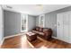 Living room with hardwood floors and brown leather couch at 55 W Lemon St, Tarpon Springs, FL 34689
