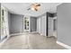Bright bedroom with tile floors and ceiling fan at 55 W Lemon St, Tarpon Springs, FL 34689