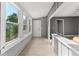 Sunroom with large windows and tile floor at 55 W Lemon St, Tarpon Springs, FL 34689