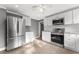 Modern kitchen with stainless steel appliances and white cabinets at 55 W Lemon St, Tarpon Springs, FL 34689