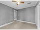 Spacious bedroom with tile floors and ceiling fan at 55 W Lemon St, Tarpon Springs, FL 34689