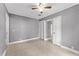 Bright bedroom with tile floors and ceiling fan at 55 W Lemon St, Tarpon Springs, FL 34689