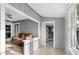 Living room with built-in shelving and sunroom access at 55 W Lemon St, Tarpon Springs, FL 34689