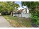 House exterior showing front porch and landscaping at 55 W Lemon St, Tarpon Springs, FL 34689