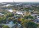 House nestled amongst lush vegetation near a waterway at 55 W Lemon St, Tarpon Springs, FL 34689