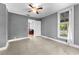 Bedroom with tile floors, ceiling fan, and view into living room at 55 W Lemon St, Tarpon Springs, FL 34689