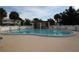 Community pool with covered seating area at 1829 Bough Ave # 4, Clearwater, FL 33760