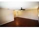Large living room with hardwood floors and ceiling fan at 1829 Bough Ave # 4, Clearwater, FL 33760