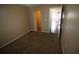 Simple bedroom with a view into another room at 1829 Bough Ave # 4, Clearwater, FL 33760