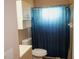 Clean bathroom with teal shower curtain and vanity at 1829 Bough Ave # 4, Clearwater, FL 33760