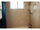 Bathroom featuring beige tile and a double shower head at 1829 Bough Ave # 4, Clearwater, FL 33760