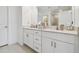 Modern bathroom with double vanity and quartz countertop at 21811 Lyonia Ln, Land O Lakes, FL 34637