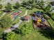 Aerial view of a playground with swings and playset at 21811 Lyonia Ln, Land O Lakes, FL 34637