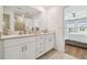 Double vanity bathroom with large mirror and shower at 21811 Lyonia Ln, Land O Lakes, FL 34637