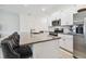 Modern kitchen with granite countertops, stainless steel appliances, and island at 21811 Lyonia Ln, Land O Lakes, FL 34637