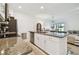 Modern kitchen with granite countertops, stainless steel appliances, and island at 21811 Lyonia Ln, Land O Lakes, FL 34637