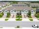 Aerial view of townhomes with a community setting at 21811 Lyonia Ln, Land O Lakes, FL 34637
