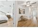 Bright hallway with hardwood floors and access to bedroom at 21811 Lyonia Ln, Land O Lakes, FL 34637