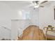 Upstairs hallway with light flooring and seating at 21811 Lyonia Ln, Land O Lakes, FL 34637